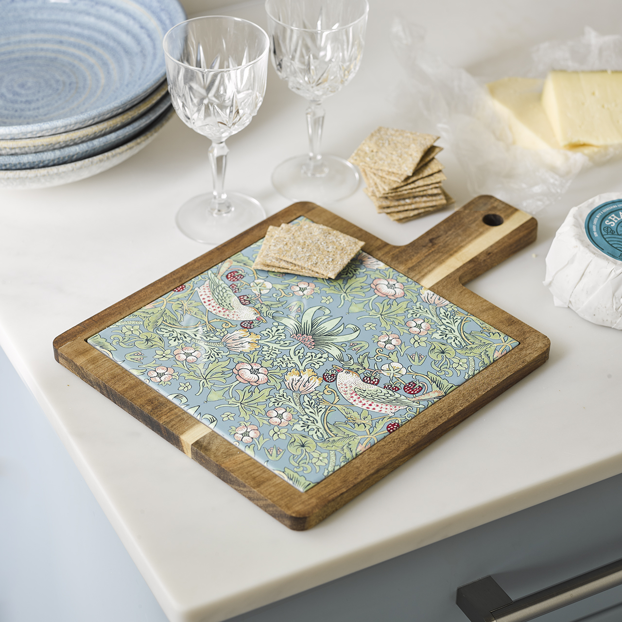 Strawberry Thief patterned tiled cheese board on a kitchen counter