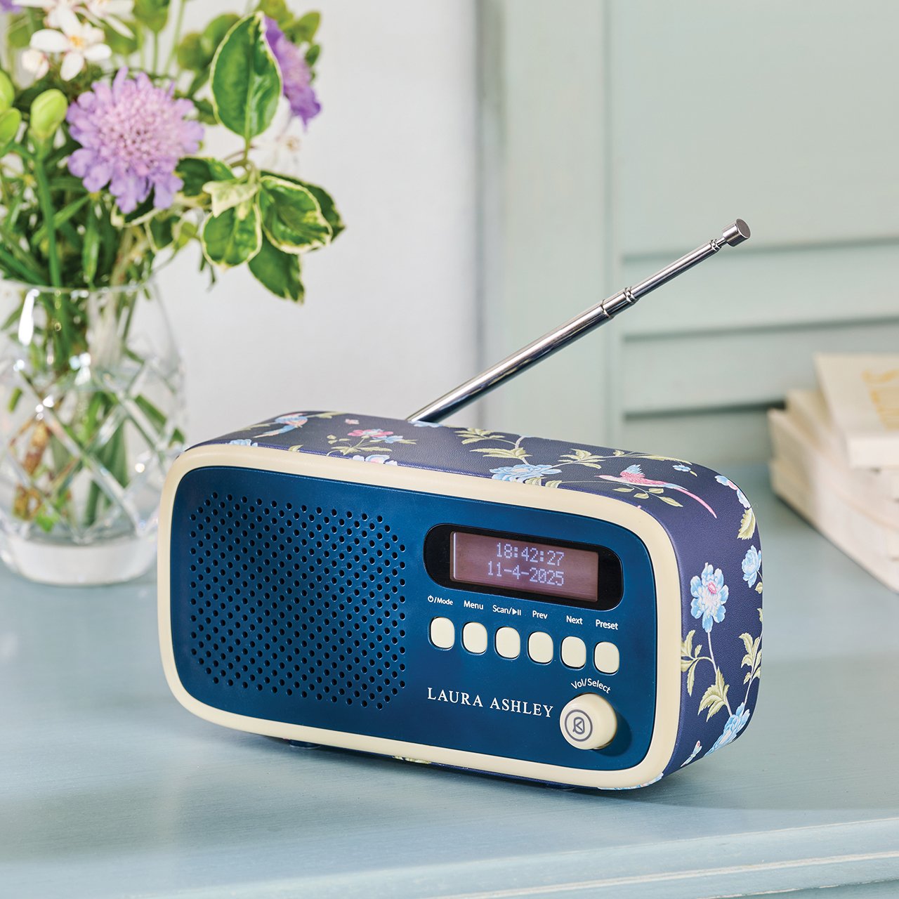Blue DAB radio with floral design and cream buttons