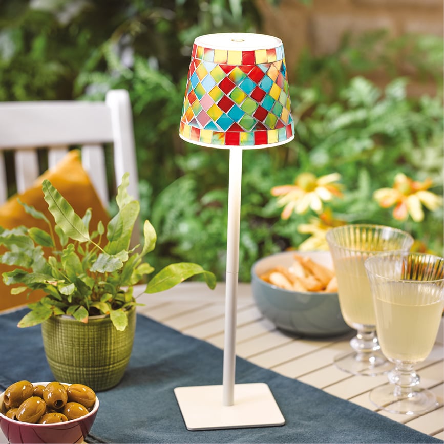 Colorful mosaic lamp on outdoor table setting