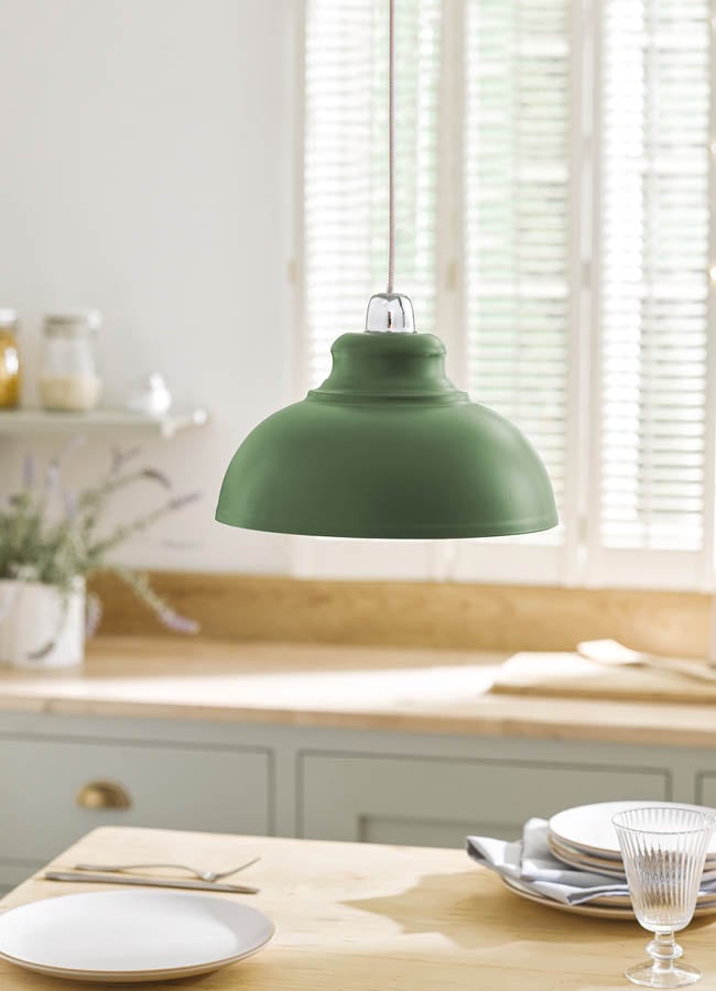 Image of a grey metal lampshade over kitchen worktop
