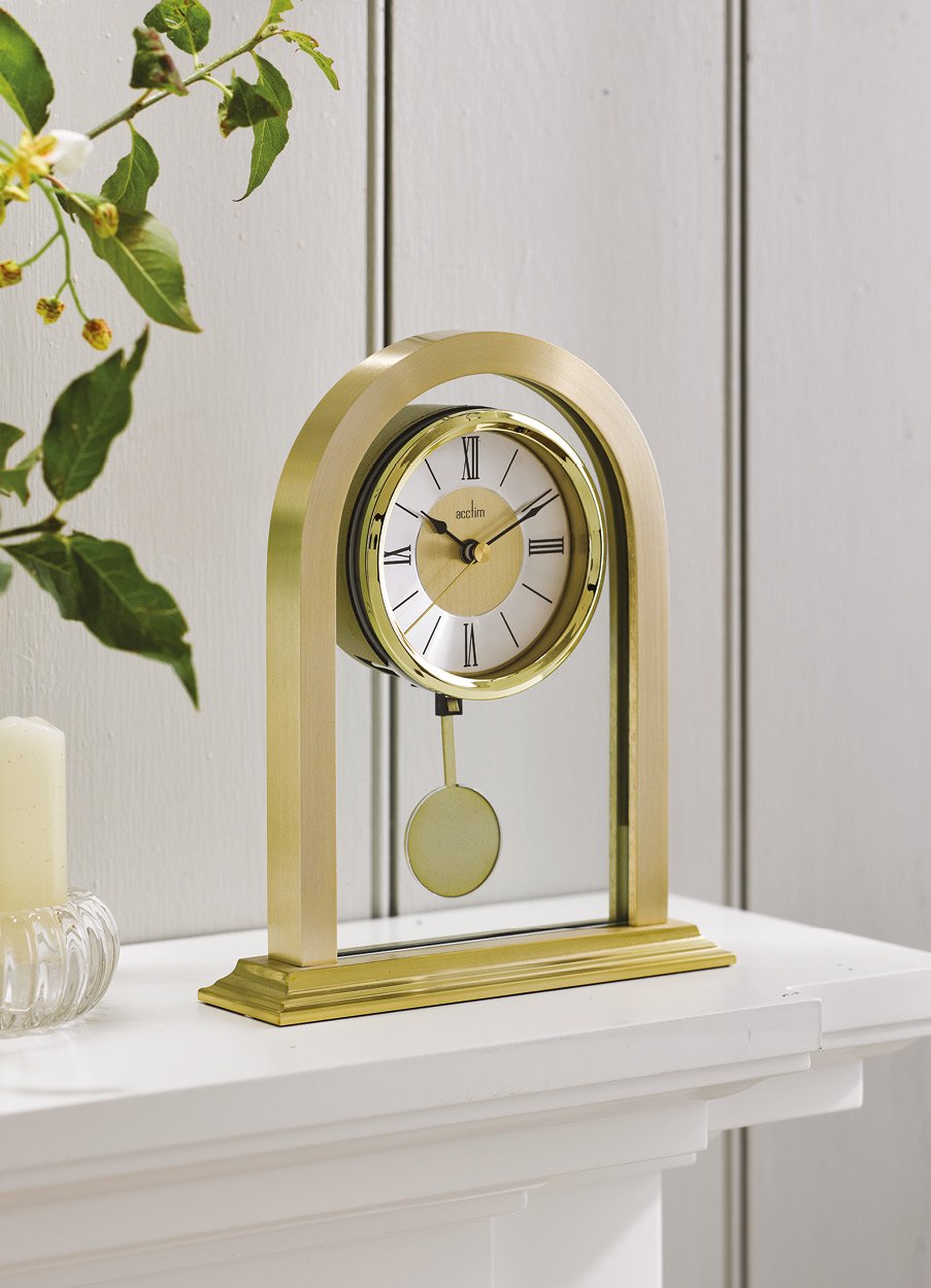 Gold mantel clock on a mantlepiece