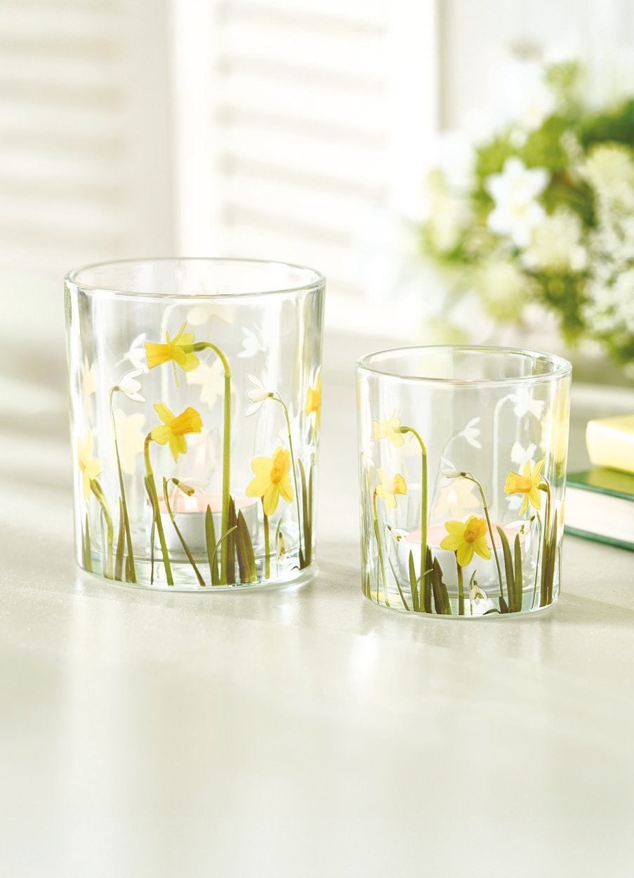 Two glass tealight holders with daffodils painted on