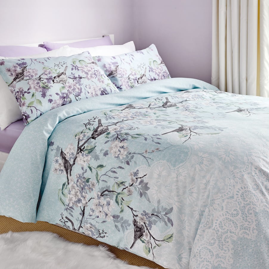 Bed with floral duvet set on