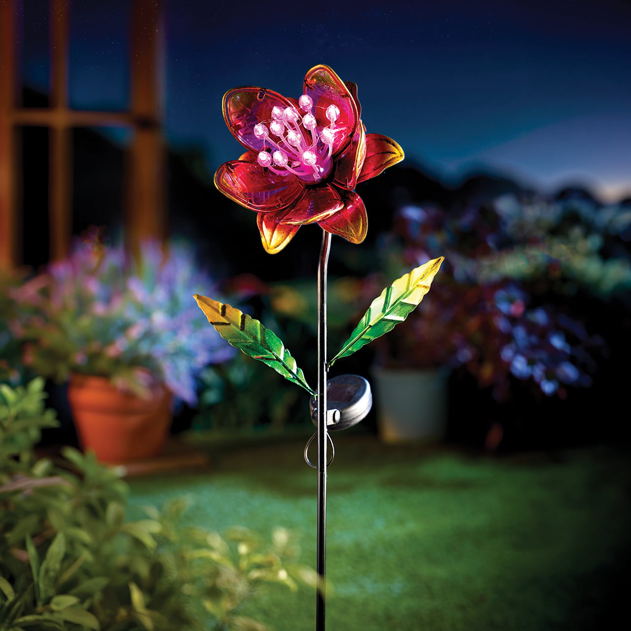 Hanging solar ornament with a cat silhouette and illuminated centre
