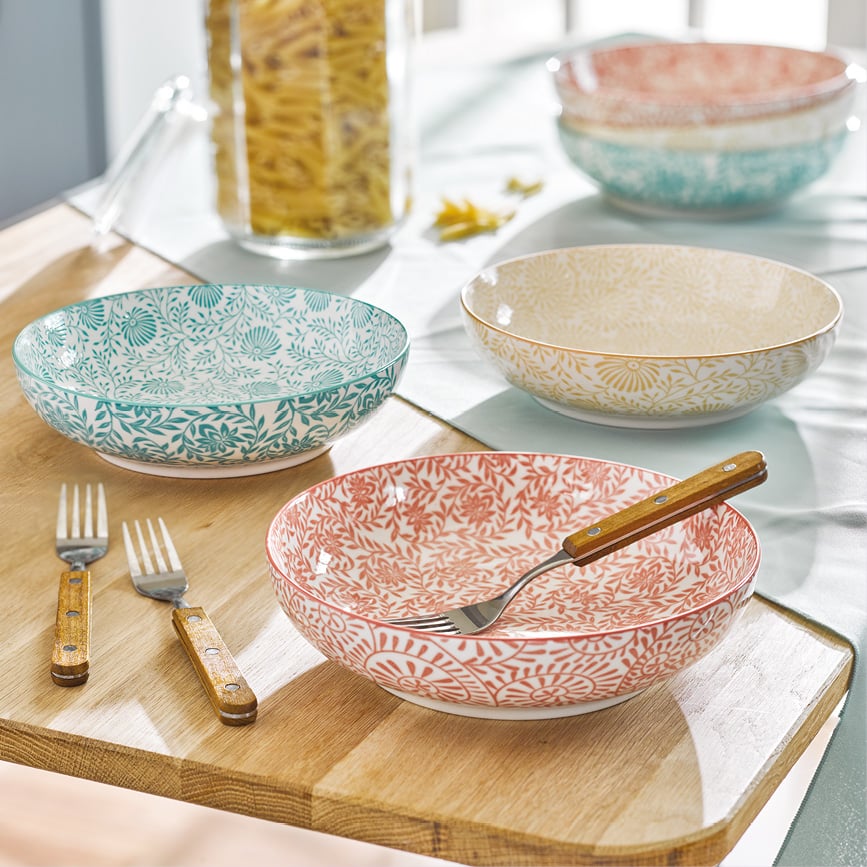 Patterned ceramic bowls on wooden kitchen table