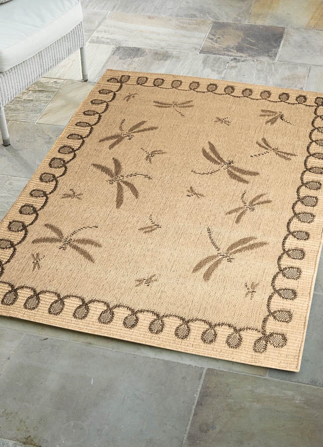 Beige outdoor rug with dragonfly design
