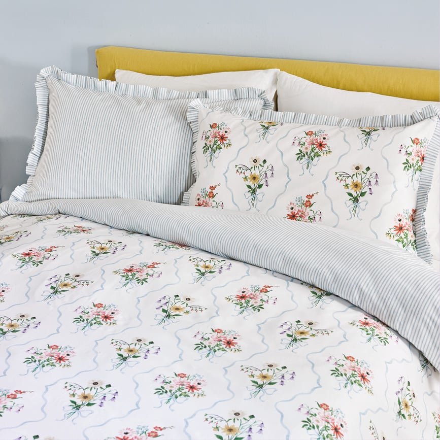 Bed with floral duvet set on
