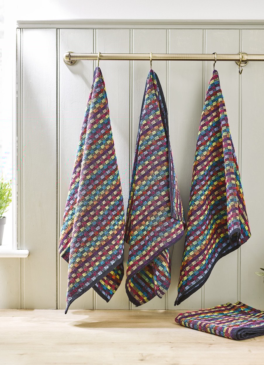 4 multicolour utility towels hanging from hooks