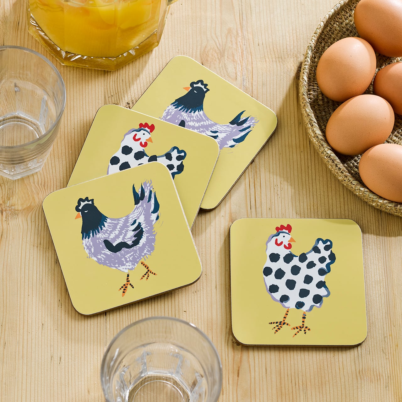 Yellow coasters with chicken illustrations