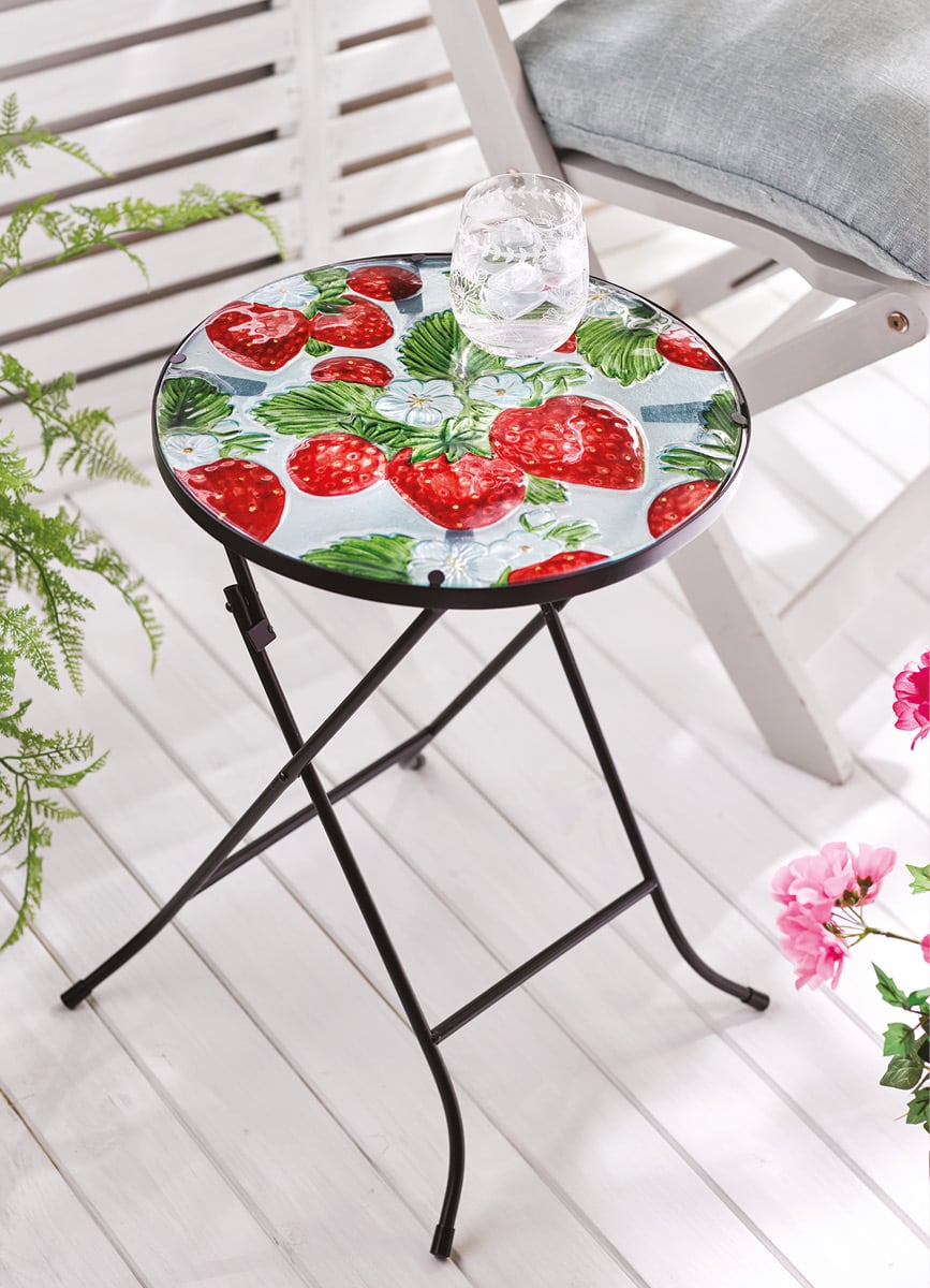 Outdoor table with strawberry design on glass top