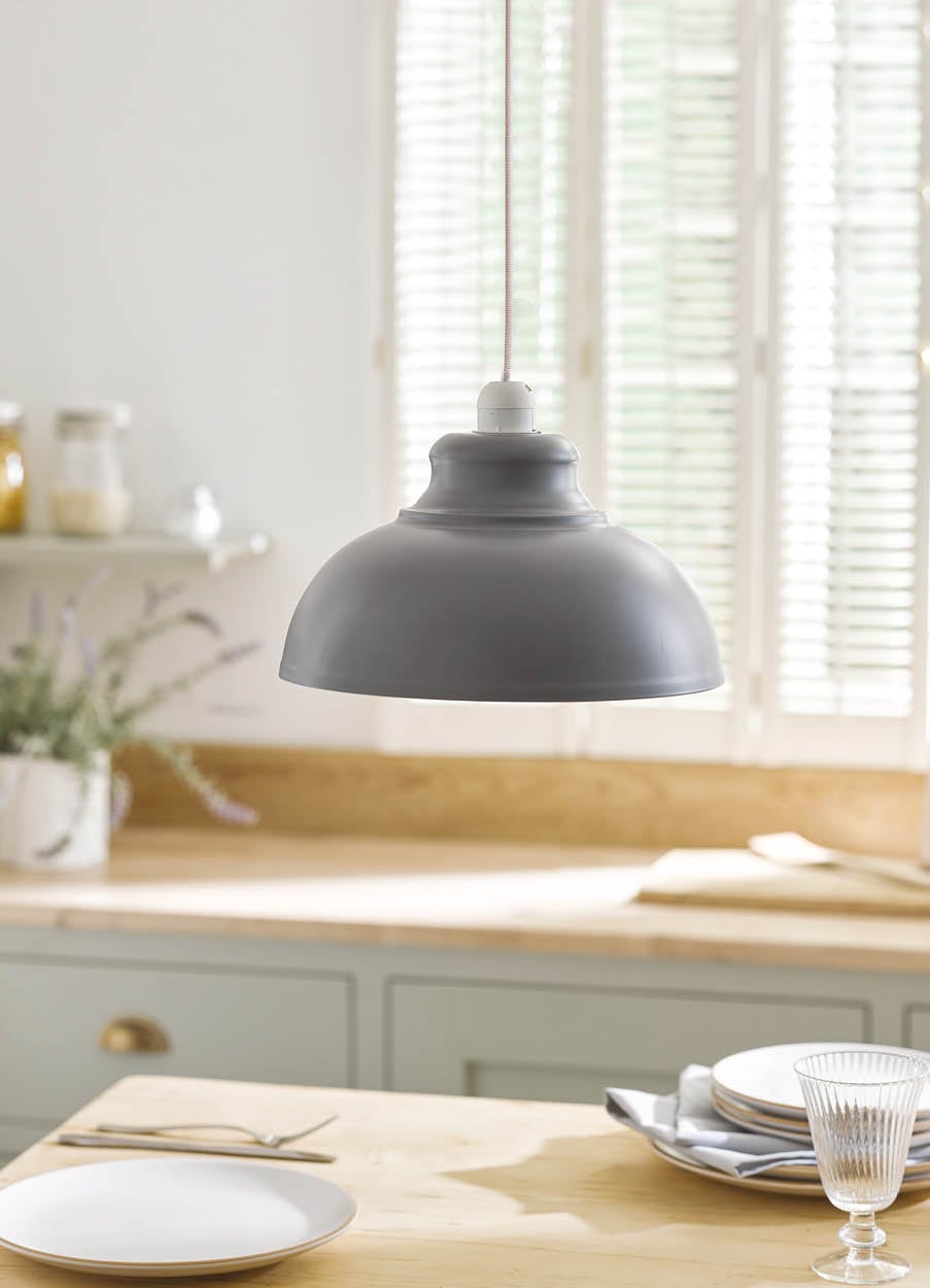 Image of a grey metal lampshade over kitchen worktop