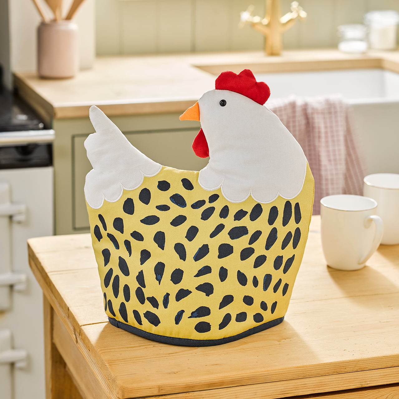 “Chicken‑shaped tea cosy on a kitchen counter