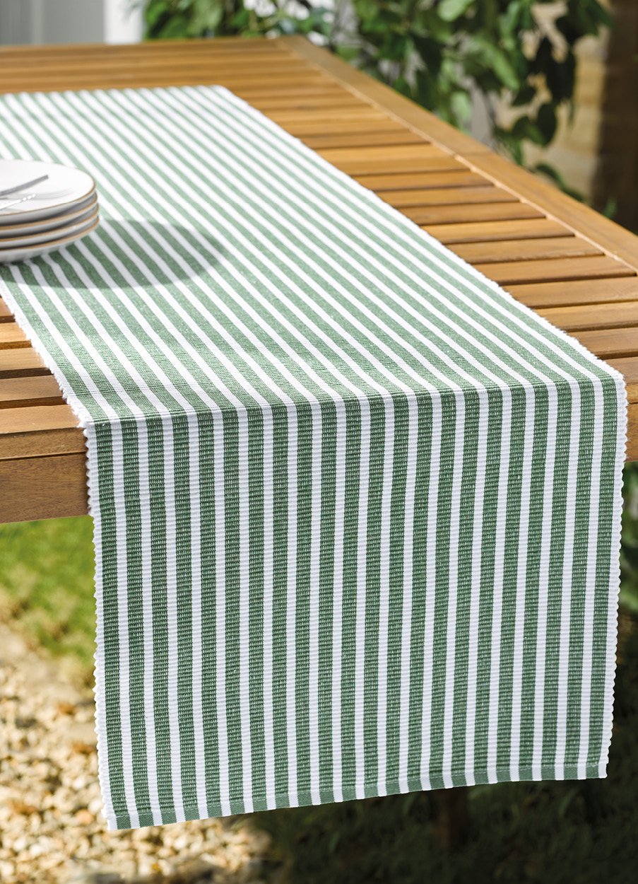 Wooden outdoor table with Green and White stripe runner