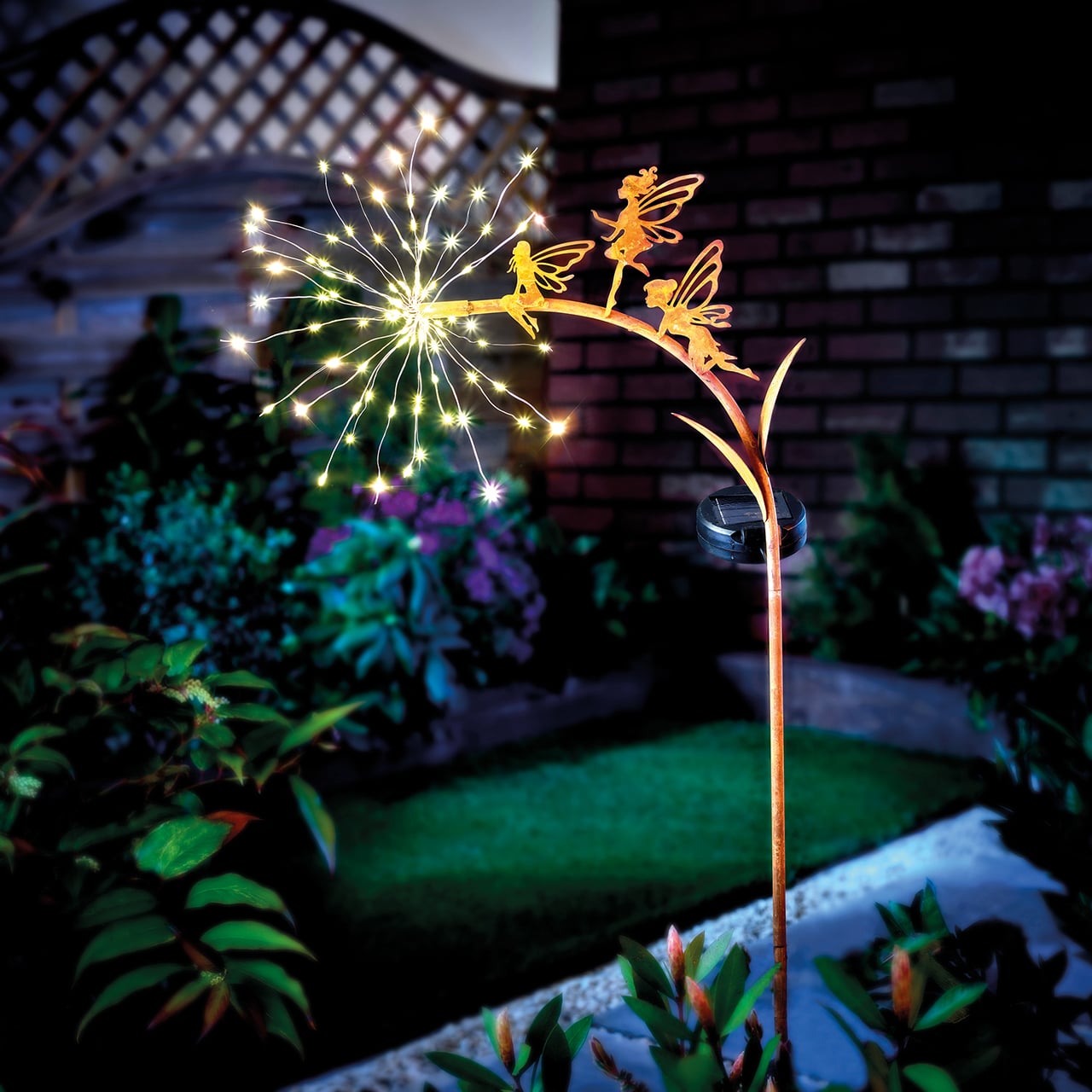Tall garden stake light with glowing fairy silhouette and warm bulbs