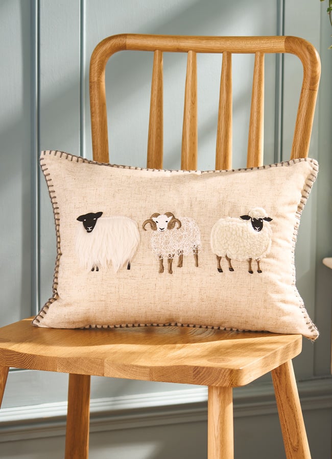 Cushion with three sheep design