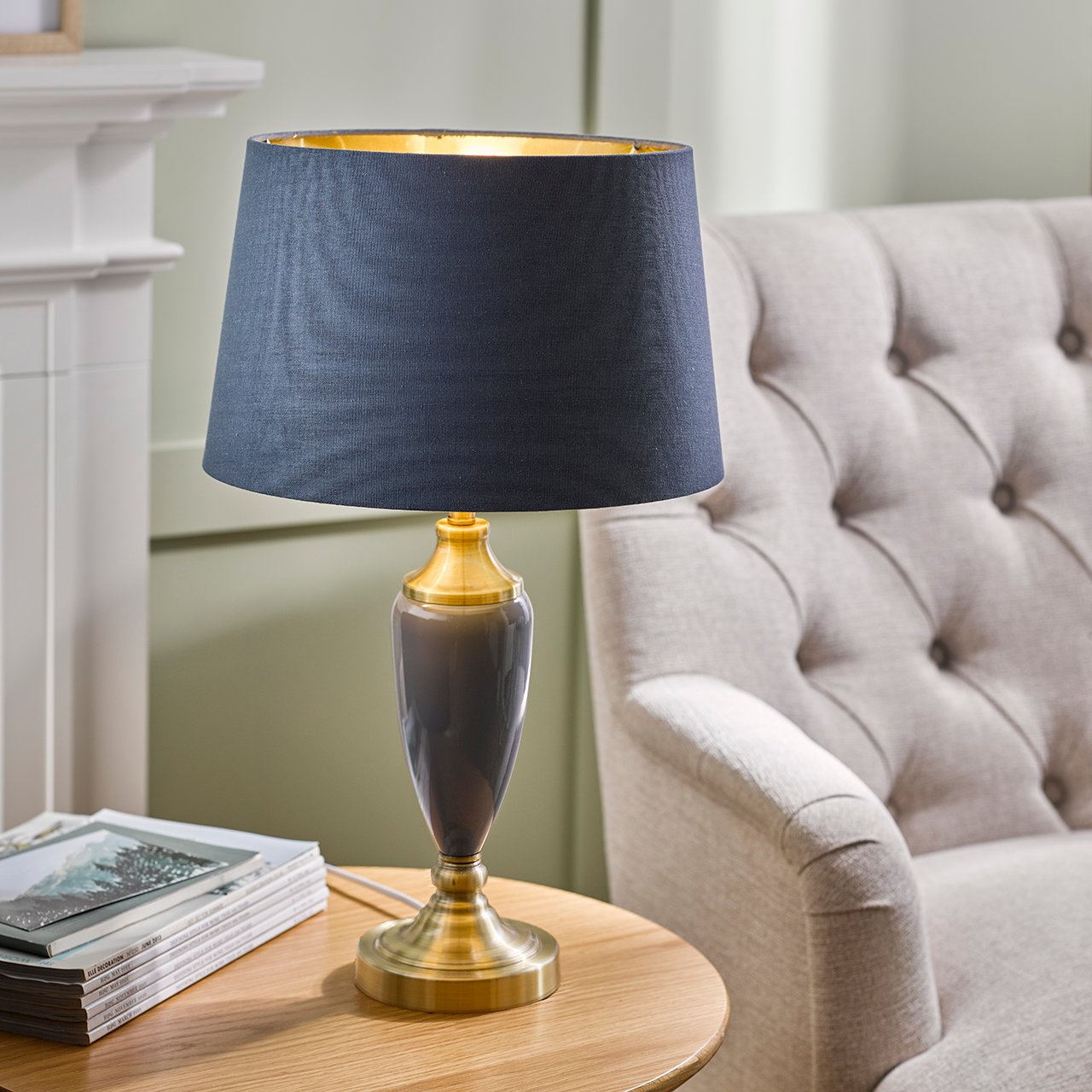 Navy blue upholstered storage bench with mahogany legs