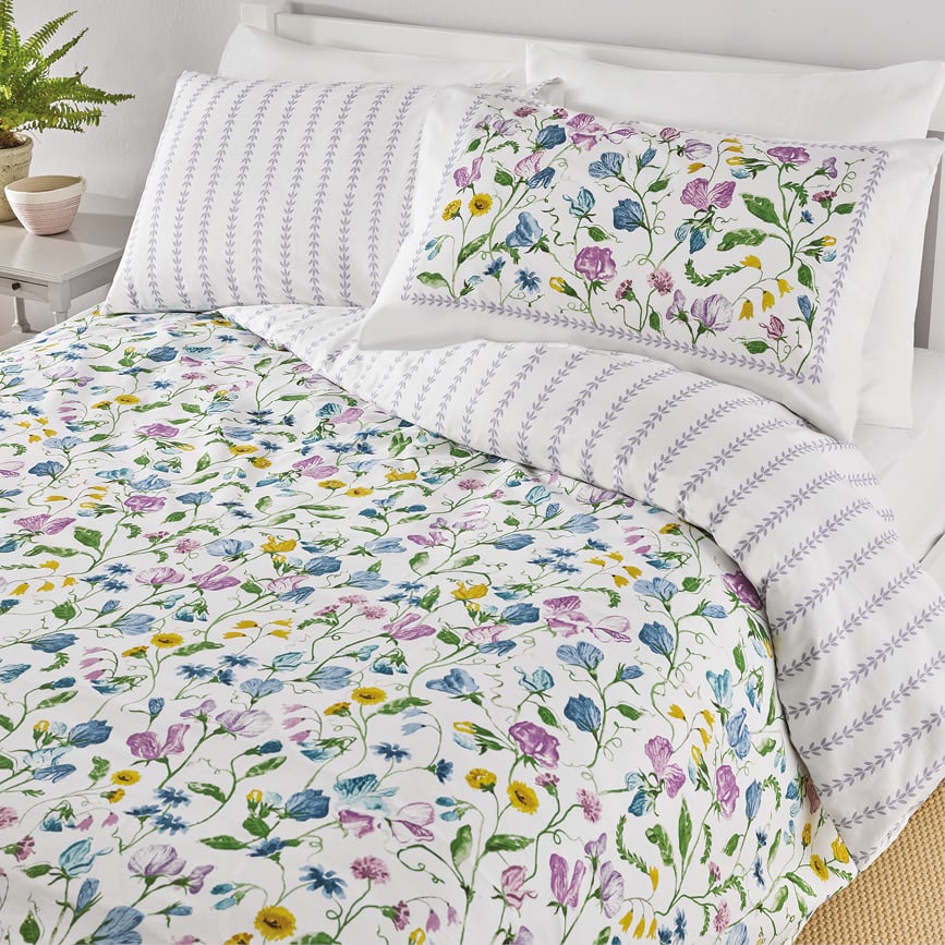 Floral bedding set with pillows on bed