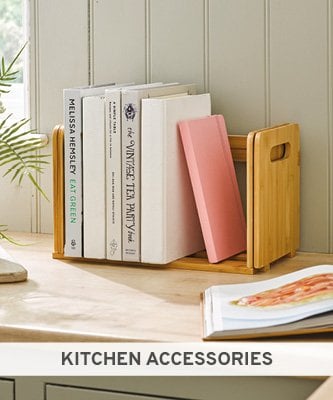 Wooden expanding bookshelf with books on