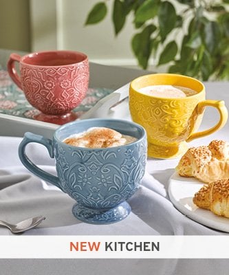 Brightly coloured footed ceramic mugs