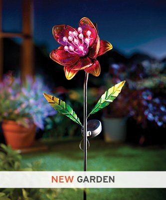 Pink solar powered flower light in garden